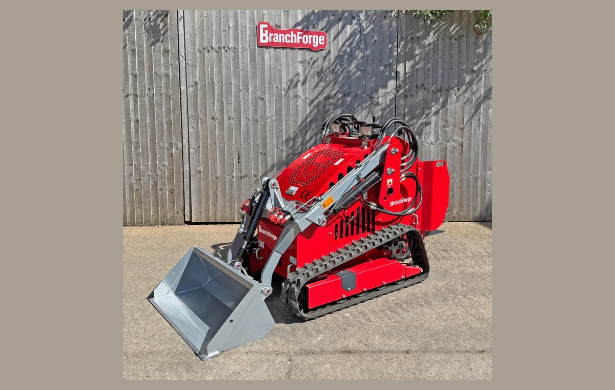 Mini skid steer loader with bucket, front three-quarter view